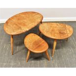 A NEST OF THREE LIGHT ERCOL 'PEBBLE' OCCASIONAL TABLES Condition Report : joints are all solid,