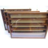 THREE WALL DISPLAY CASES of wood and board construction, each with four fixed shelves and a