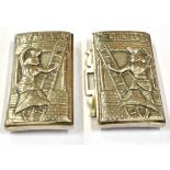 A WHITE METAL BELT BUCKLE WITH EGYPTIAN FIGURE DECORATION Both sections with embossed scene of