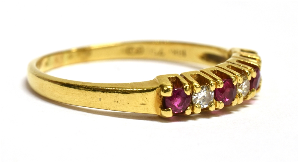 A MODERN RUBY AND DIAMOND SEVEN STONE RING Four small round cut rubies and three small cut - Image 3 of 4
