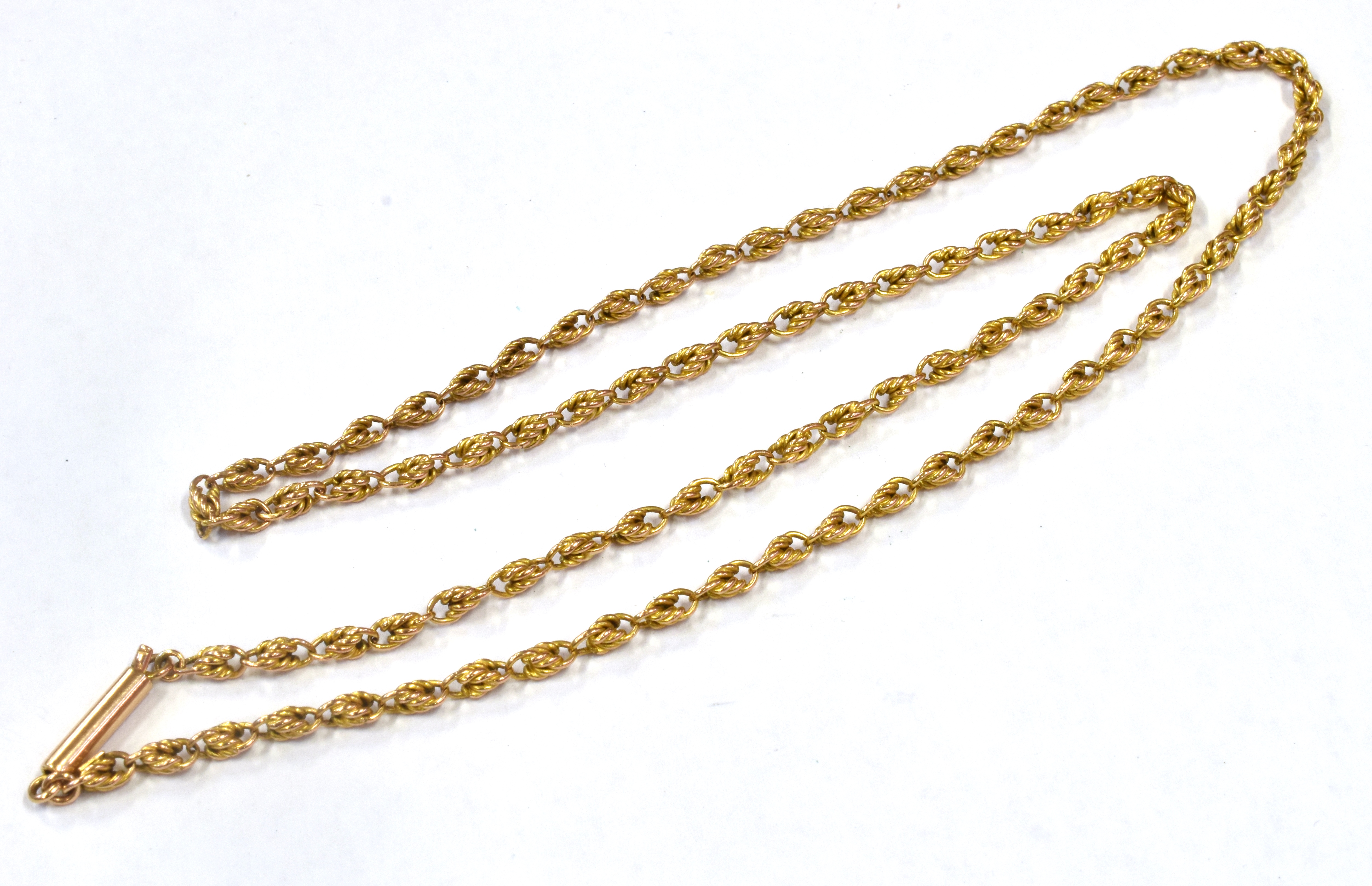 A LATE VICTORIAN/EDWARDIAN 9CT GOLD CHAIN The fancy knot design links to a barrel snap clasp, - Image 2 of 2