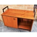 AN AVALON TEAK RECORD CABINET with sliding doors enclosing fitted interior, on metal side