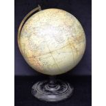 A PHILIPS 12' TERRESTRIAL GLOBE c.1930s mounted on brass meridian and turned ebonised base, labelled