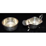 A SILVER SAUCE BOAT AND SMALL SILVER BOWL The rectangular form sauce boat with canted corners on