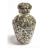 A VICTORIAN SILVER MINIATURE SCENT FLASK The bottle form flask with all over embossed foliate