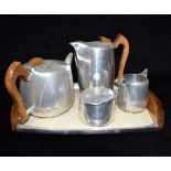 A FOUR PIECE PICQUOT WARE TEA SET and matching tray Condition Report : all pieces in good