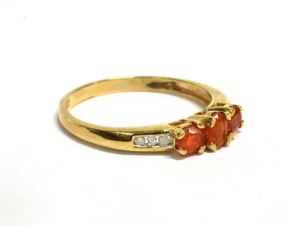 A FIRE OPAL THREE STONE 9CT GOLD RING The three oval cut fire opals approx. 4.5mm x 3mm, size N, - Image 2 of 3