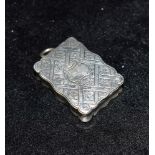 A VICTORIAN SMALL SILVER VINAIGRETTE By ASTON & SON the floral diaper decoration and plain centre