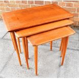 A SCANDINAVIAN NEST OF THREE TEAK COFEE TABLES, the middle table (indistinctly) stamped 'MADE IN
