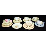 A GROUP OF PARAGON TEA CUPS, SAUCERS AND SIDE PLATES WTIH FLOWER HANDLES including 'A Country Lane