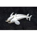 ARNO MALINOWSKI FOR GEORG JENSEN: A Danish sterling silver 'double dolphin', number 317, stamped