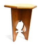 AN ARTS & CRAFTS STYLE WALNUT OCCASIONAL TABLE/STOOL with octagonal top, on shaped supports with