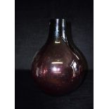 A VERY LARGE SWEDISH AUBERGINE COLOURED ART GLASS VASE of bulbous form, unsigned, paper label '