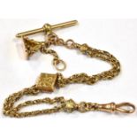 A VICTORIAN 9 CT GOLD ALBERTINA CHAIN The two row fancy link chain with floral patterned lozenge