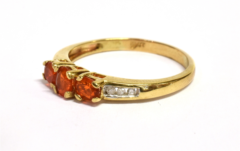 A FIRE OPAL THREE STONE 9CT GOLD RING The three oval cut fire opals approx. 4.5mm x 3mm, size N, - Image 3 of 3