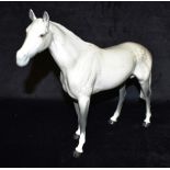 A BESWICK IMPERIAL GREY FIGURE OF A HORSE model 1557, 29cm high Condition Report : clean break to