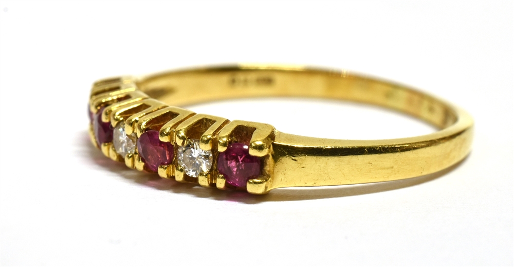 A MODERN RUBY AND DIAMOND SEVEN STONE RING Four small round cut rubies and three small cut - Image 4 of 4