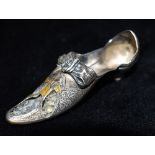 A VICTORIAN SILVER PIN CUSHION IN THE FORM OF A SHOE The heeled shoe pin cushion with bow (note