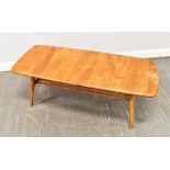 A LIGHT ERCOL COFFEE TABLE with magazine rack undertier, the rectangular top 105cm x 44cm