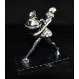 A 1930S RONSON ART DECO TABLE LIGHTER the spherical lighter held by a young girl in striding pose