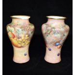 A PAIR OF ROYAL WORCESTER BALUSTER SHAPED VASES each with painted fruit decoration signed Telford,