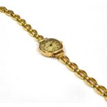 A LADIES PIERCE 9CT GOLD VINTAGE WATCH on a plated bracelet, the c1920s watch with .375 mark to