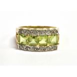 A PERIDOT FOUR STONE AND DIAMOND SET RING The four square cut peridot 4mm very small diamond to