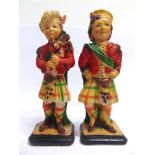 A PAIR OF PLASTER SCOTTISH FIGURES circa 1930, in traditional attire, with a hand- and spray-painted