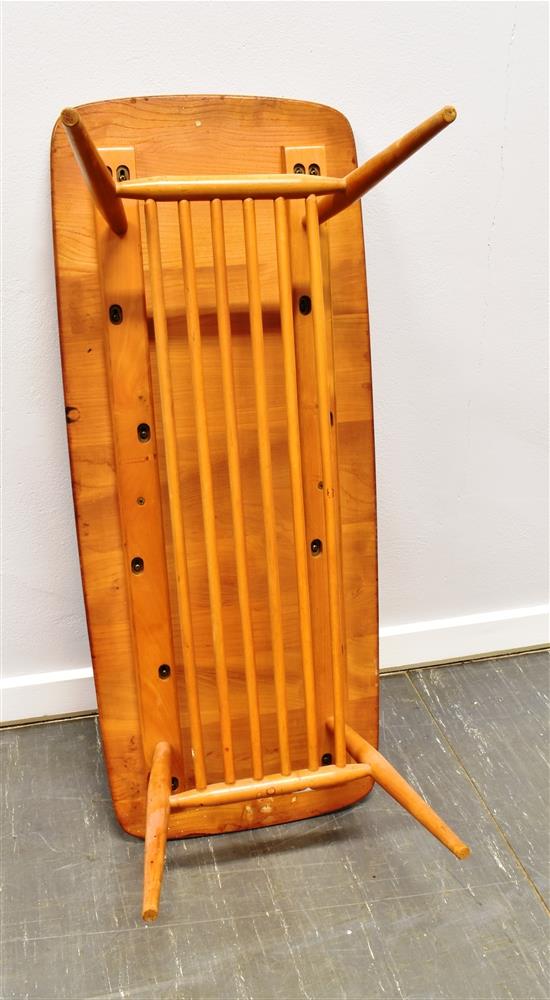 A LIGHT ERCOL COFFEE TABLE with magazine rack undertier, the rectangular top 105cm x 44cm - Image 2 of 2