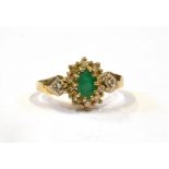 AN EMERALD AND DIAMOND CLUSTER 9CT GOLD RING Comprising an oval cut emerald 6mm x 4mm, a surround at