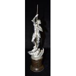 A WMF CAST METAL FIGURE OF ST GEORGE SLAYING THE DRAGON on circular marble socle, marked 'WMF'