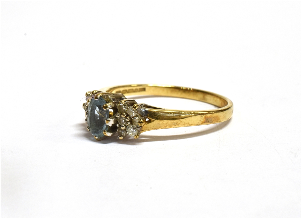 AN AQUAMARINE AND DIAMOND SET GOLD RING the central oval cut aquamarine approx. 6 x 4mm with six - Image 4 of 5