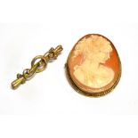 A 9CT GOLD OVAL SHELL CAMEO BROOCH Head and shoulders of a young lady, hallmarked 9ct gold mount and