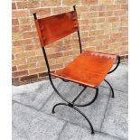 AN IRON FRAMED LEATHER UPHOLSTERED CHAIR and a similar magazine rack/log basket Condition Report :