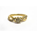 A SMALL DIAMOND CLUSTER 9CT GOLD RING Seven small round brilliant cut diamonds to cluster, very