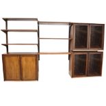 POUL CADOVIUS: A DANISH ROSEWOOD 'SYSTEM CADO' SUITE OF WALL MOUNTED FURNITURE comprising: three