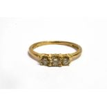 A CHAMPAGNE DIAMOND THREE STONE 9CT GOLD RING The three champagne coloured diamonds weighing a total