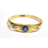 AN EARLY 20TH CENTURY SMALL BLUE SAPPHIRE AND DIAMOND SET 18CT GOLD RING The boat shaped head to