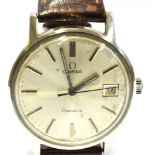 A GENT'S VINTAGE OMEGA STEEL WATCH The round steel dial with date window to 3 o'clock to steel