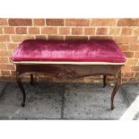 MAHOGANY PIANO STOOL, having a pink upholstered lift up seat, with moulded decoration to the