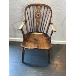 AN ELM SEATED WINDSOR WHEELBACK ARMCHAIR, 91cm high