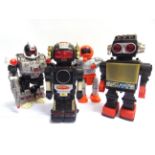 FOUR PLASTIC BATTERY-OPERATED ROBOTS comprising a New Bright [Hong Kong] Magic Mike II (untested;