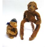 A SOFT TOY MONKEY circa 1930s, with a brown mohair body, felt face, ears, hands and feet, and