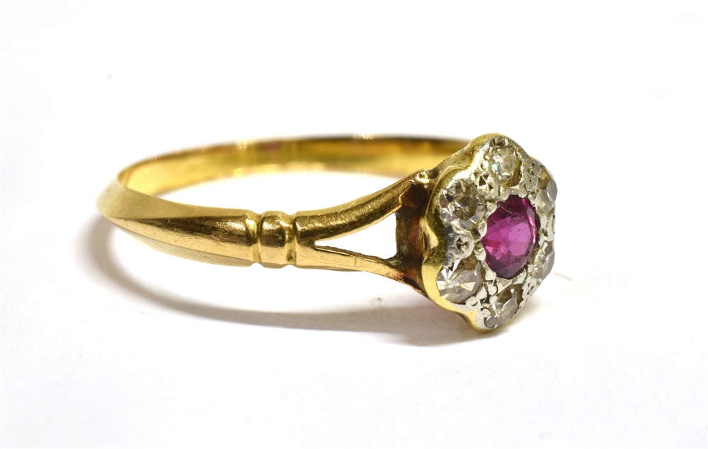 A RUBY AND DIAMOND 18 CT GOLD CLUSTER RING The round cluster comprising a small round cut ruby - Image 2 of 2