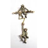 AN EDWARDIAN PASTE SET SILVER DOUBLE MONKEY BROOCH PIN The cheeky monkey brooch comprising two