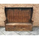 PINE SETTLE, with panelled back, shaped arms and boxed seat, 163cm x 187cm x 57cm