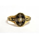 A VICTORIAN 18CT GOLD MOURNING RING the signet style mourning ring with an oval head set with seed