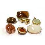 SEVEN ITEMS OF VICTORIAN SMALL BROOCHES Comprising five hardstone set brooches and an anchor
