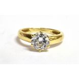 A CUBIC ZIRCONIA SINGLE STONE 14CT GOLD RING The CZ approx. 7mm diameter claw set to 14ct gold