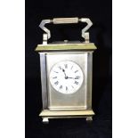 A BRASS CASED CARRIAGE CLOCK WITH REPEAT MECHANISM the movement stamped 'HJ' with parrot for Henri